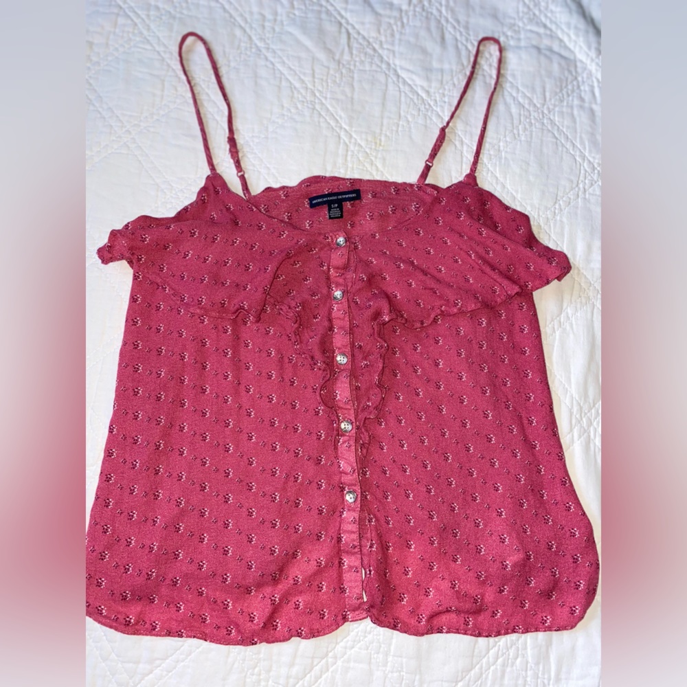 American Eagle top. Button up w/ ruffle at the top. Light maroon/mauve color.